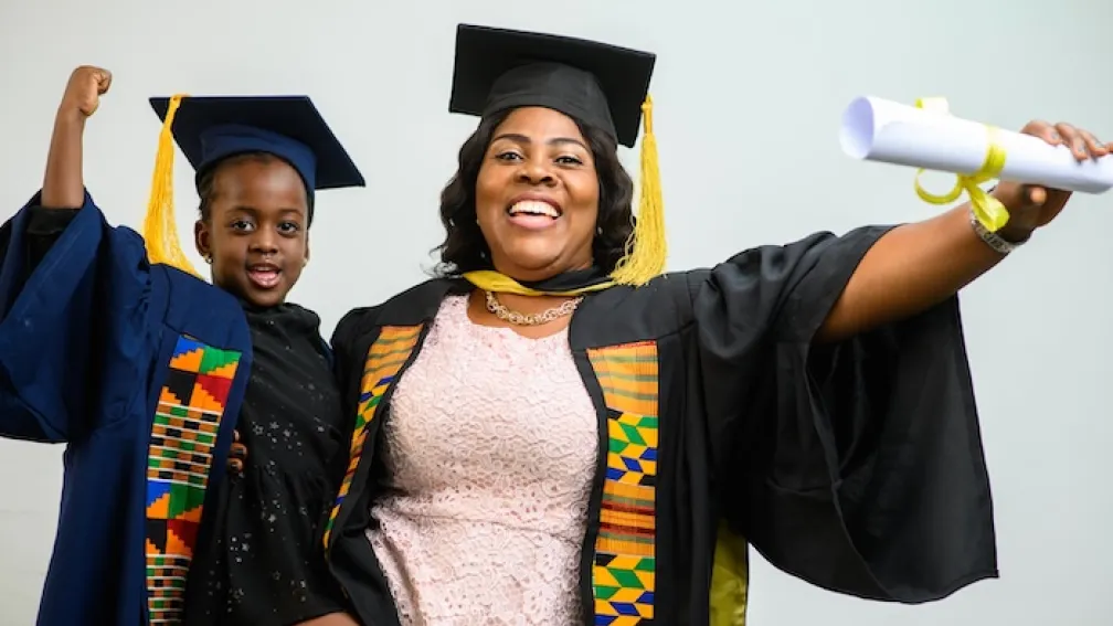 Mum and child in a graduation robes